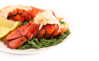 Wall Mural - Broiled Lobster Tails on a Bed of Kale with Lemon Slices