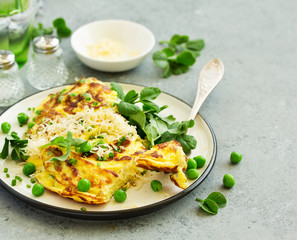 Wall Mural - Breakfast. Frittata Italian omelet with green peas and salad.