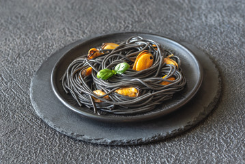 Canvas Print - Black pasta with mussels and parmesan