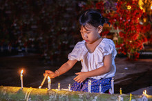 Little Girl Is Burning Candles