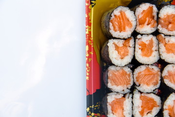 Wall Mural - Sushi Roll with salmon on the white background .Food abstract background