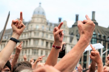 People showing middle finger in London protest