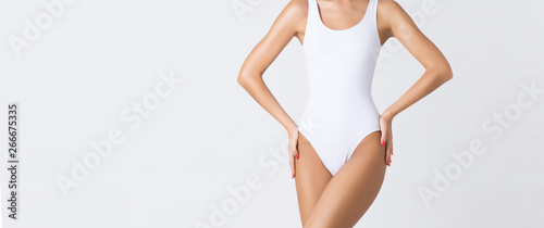 Cuadros en Lienzo Young, fit and beautiful girl in sporty swimsuit