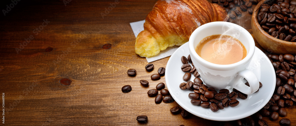 Espresso and croissant with coffee beans on wood background - obrazy, fototapety, plakaty 