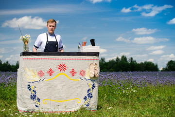 catering bar service. Bartender job on the departure. Handsome bartender near the bar counter, outdoors