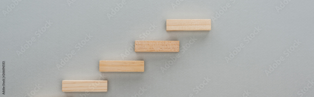 panoramic shot of wooden blocks symbolizing career ladder isolated on grey - obrazy, fototapety, plakaty 