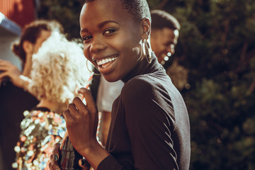 Cheerful woman hanging out with friends