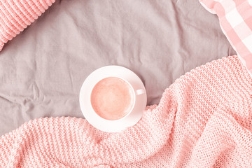 Wall Mural - Bed with pink knitted plaid and coffee