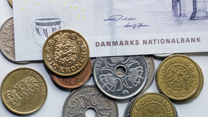 Wall Mural - Danish fifty Kroner banknote with a mixed selection of coins in a panoramic format - Kroner is the official currency of Denmark.