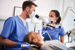 © gpointstudio - Conversation between two dentist in dentist's clinic