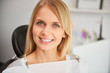 © gpointstudio - Portrait of pleased and smiling woman in dentist's clinic