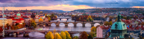 Photo Sunset in Prague panorama, view to the historical bridges, old town and Vltava r