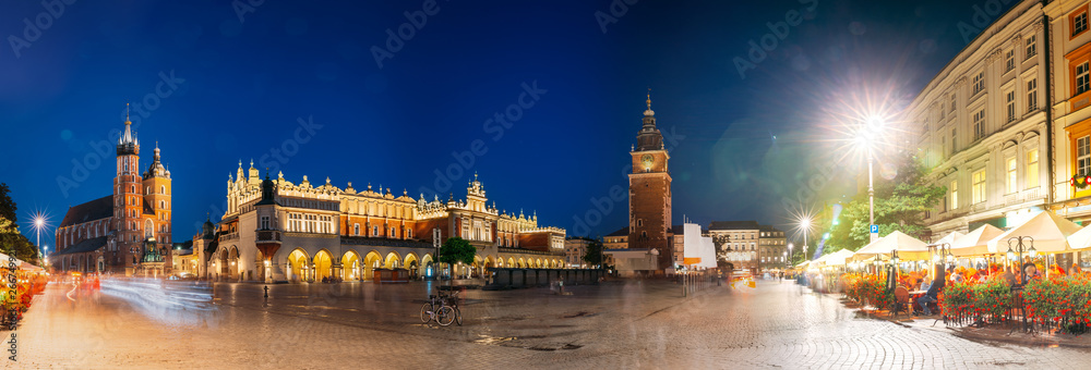 Krakow, Poland. Famous Landmarks On Old Town Square In Summer Evening. St. Mary's Basilica, Cloth Hall Building And Old Town Hall Tower In Night Lighting. UNESCO World Heritage Site. Panoramic View - obrazy, fototapety, plakaty 