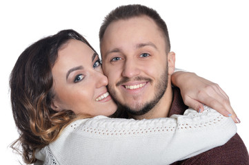 Happy young couple hugging isolated on white background