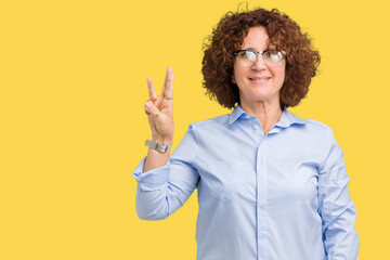 Beautiful middle ager senior businees woman wearing glasses over isolated background showing and pointing up with fingers number three while smiling confident and happy.