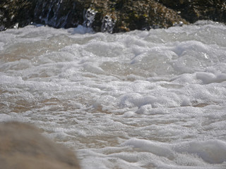 Waves crashing against the rock