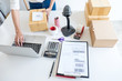 © Freedomz - Small business owner delivery service and working packing box, business owner working checking order to confirm before sending customer in post office, Shipment Online Sales
