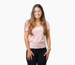 © Krakenimages.com - Young beautiful brunette woman wearing pink t-shirt over isolated background with a happy and cool smile on face. Lucky person.