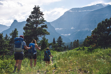 Wall Mural - Women Backpacking in Glacier National Park in Montana During Summer