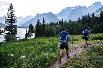 women backpacking in glacier national park in montana during summer