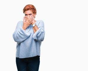 Poster - Atrractive senior caucasian redhead woman wearing winter sweater over isolated background shocked covering mouth with hands for mistake. Secret concept.