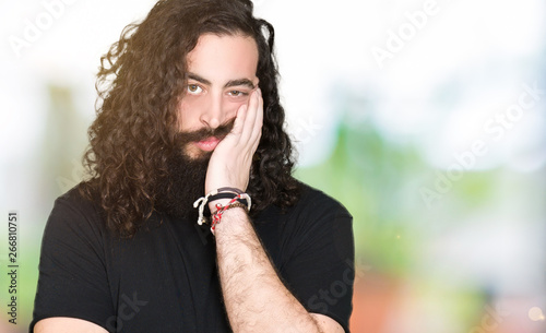 Young Man With Long Hair And Beard Wearing Heavy Metal Black