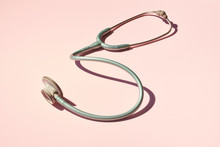 Stethoscope On Pink Background  Table 