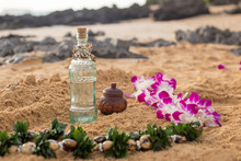 Lei And Ceremony Bottles On Beach