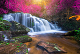 Fototapeta Krajobraz - Amazing in nature, beautiful waterfall at colorful autumn forest in fall season