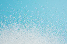 White Sugar Splash On Blue Background Texture Top View