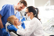 © gpointstudio - Dentist and her assistant doing their work in dentist's clinic