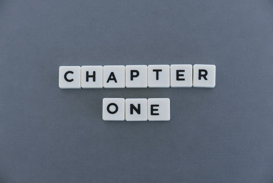 Chapter one word made of square letter word on grey background.