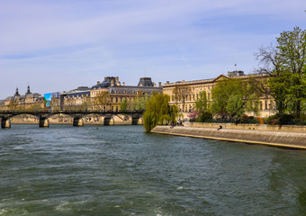 Wall Mural - Pedestrian bridge (Pont des Arts) over Seine river and historic buildings of Paris France