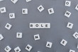Role word made of square letter word on grey background.