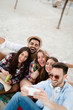 © NDABCREATIVITY - Happy young people taking selfies