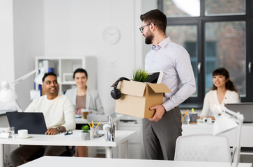 Wall Mural - business, new job and quit concept - happy smiling male office worker with personal stuff