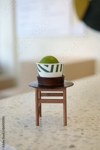 Ice Cream Scoops In White Cups Of Matcha Green Tea On Blur