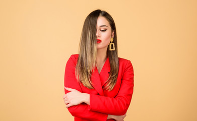 Cute and stylish. Fashion portrait of elegant woman. beauty and fashion. hair beauty and hairdresser salon. jewelry earrings. Girl in red jacket. Sexy woman with professional makeup