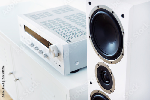 Fotografía Modern audio stereo system with white speakers on bureau in modern interior