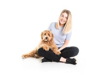 Wall Mural - woman with his Golden Labradoodle dog isolated on white background