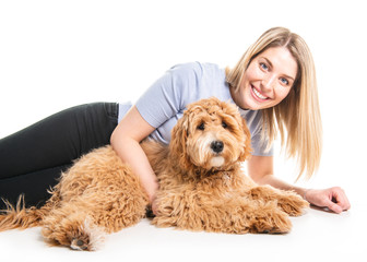 Wall Mural - woman with his Golden Labradoodle dog isolated on white background