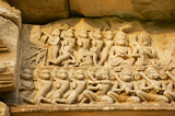 Sandstone carving with religious motifs at the ruins of the Hindu temple in Phimai historical park (Prasat Hin Phimai) in Thailand.