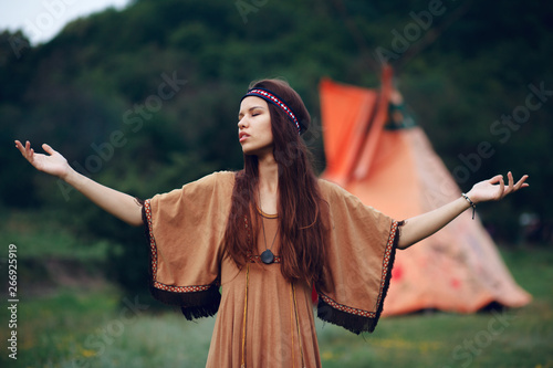 Fotomural Native indian woman with traditional hairstyle outside in wild forest