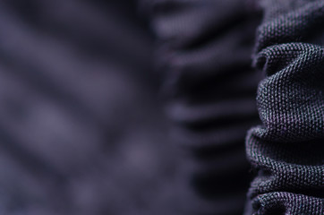 Black material textile cloth texture blur background