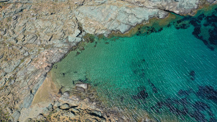 Aerial drone photo of famous beach of Kolympithres with deep turquoise sea, Tinos island, Cyclades, Greece