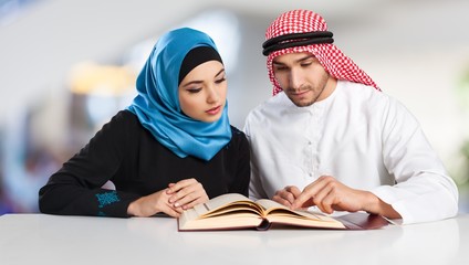 Wall Mural - Portrait of arab couple with laptop on  background