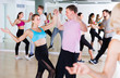 © JackF - dancing couples of joyous men and women learning swing