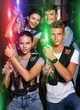 © JackF - Group of friends playing laser tag  game with laser guns in dark