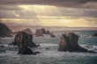 © Alvaro Sanchez/ADDICTIVE STOCK - Picturesque view of beautiful cliff on calm smooth seashore on background of grey sky
