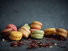 Bright Fresh Tasty Macaron Biscuits On Grey Board And Dry Fruits